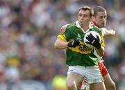 25 September 2005; William Kirby, Kerry, in action against Stephen O'Neill, Tyrone. Bank of Ireland All-Ireland Senior Football Championship Final, Kerry v Tyrone, Croke Park, Dublin. Picture credit; Brendan Moran / SPORTSFILE *** Local Caption *** Any photograph taken by SPORTSFILE during, or in connection with, the 2005 Bank of Ireland All-Ireland Senior Football Final which displays GAA logos or contains an image or part of an image of any GAA intellectual property, or, which contains images of a GAA player/players in their playing uniforms, may only be used for editorial and non-advertising purposes.  Use of photographs for advertising, as posters or for purchase separately is strictly prohibited unless prior written approval has been obtained from the Gaelic Athletic Association.