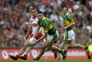 25 September 2005; Darragh O Se, Kerry, in action against Brian McGuigan, Tyrone. Bank of Ireland All-Ireland Senior Football Championship Final, Kerry v Tyrone, Croke Park, Dublin. Picture credit; Brendan Moran / SPORTSFILE *** Local Caption *** Any photograph taken by SPORTSFILE during, or in connection with, the 2005 Bank of Ireland All-Ireland Senior Football Final which displays GAA logos or contains an image or part of an image of any GAA intellectual property, or, which contains images of a GAA player/players in their playing uniforms, may only be used for editorial and non-advertising purposes.  Use of photographs for advertising, as posters or for purchase separately is strictly prohibited unless prior written approval has been obtained from the Gaelic Athletic Association.