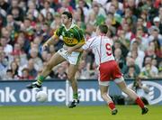 25 September 2005; Aidan O'Mahony, Kerry, in action against Sean Cavanagh, Tyrone. Bank of Ireland All-Ireland Senior Football Championship Final, Kerry v Tyrone, Croke Park, Dublin. Picture credit; Brendan Moran / SPORTSFILE *** Local Caption *** Any photograph taken by SPORTSFILE during, or in connection with, the 2005 Bank of Ireland All-Ireland Senior Football Final which displays GAA logos or contains an image or part of an image of any GAA intellectual property, or, which contains images of a GAA player/players in their playing uniforms, may only be used for editorial and non-advertising purposes.  Use of photographs for advertising, as posters or for purchase separately is strictly prohibited unless prior written approval has been obtained from the Gaelic Athletic Association.