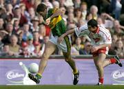 25 September 2005; Eoin Brosnan, Kerry, in action against Davy Harte, Tyrone. Bank of Ireland All-Ireland Senior Football Championship Final, Kerry v Tyrone, Croke Park, Dublin. Picture credit; Brendan Moran / SPORTSFILE *** Local Caption *** Any photograph taken by SPORTSFILE during, or in connection with, the 2005 Bank of Ireland All-Ireland Senior Football Final which displays GAA logos or contains an image or part of an image of any GAA intellectual property, or, which contains images of a GAA player/players in their playing uniforms, may only be used for editorial and non-advertising purposes.  Use of photographs for advertising, as posters or for purchase separately is strictly prohibited unless prior written approval has been obtained from the Gaelic Athletic Association.