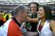 25 September 2005; Tyrone manager Mickey Harte celebrates with his daughter Michaela after the final whistle. Bank of Ireland All-Ireland Senior Football Championship Final, Kerry v Tyrone, Croke Park, Dublin. Picture credit; Brendan Moran / SPORTSFILE *** Local Caption *** Any photograph taken by SPORTSFILE during, or in connection with, the 2005 Bank of Ireland All-Ireland Senior Football Final which displays GAA logos or contains an image or part of an image of any GAA intellectual property, or, which contains images of a GAA player/players in their playing uniforms, may only be used for editorial and non-advertising purposes.  Use of photographs for advertising, as posters or for purchase separately is strictly prohibited unless prior written approval has been obtained from the Gaelic Athletic Association.