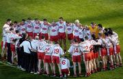 25 September 2005; The Tyrone squad and management pictured in a huddle before the match. Bank of Ireland All-Ireland Senior Football Championship Final, Kerry v Tyrone, Croke Park, Dublin. Picture credit; Damien Eagers/ SPORTSFILE *** Local Caption *** Any photograph taken by SPORTSFILE during, or in connection with, the 2005 Bank of Ireland All-Ireland Senior Football Final which displays GAA logos or contains an image or part of an image of any GAA intellectual property, or, which contains images of a GAA player/players in their playing uniforms, may only be used for editorial and non-advertising purposes.  Use of photographs for advertising, as posters or for purchase separately is strictly prohibited unless prior written approval has been obtained from the Gaelic Athletic Association.