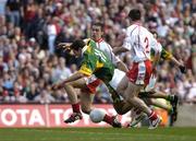 25 September 2005; Eoin Brosnan, Kerry, is tackled by Joe McMahon, Tyrone. Bank of Ireland All-Ireland Senior Football Championship Final, Kerry v Tyrone, Croke Park, Dublin. Picture credit; Brendan Moran / SPORTSFILE *** Local Caption *** Any photograph taken by SPORTSFILE during, or in connection with, the 2005 Bank of Ireland All-Ireland Senior Football Final which displays GAA logos or contains an image or part of an image of any GAA intellectual property, or, which contains images of a GAA player/players in their playing uniforms, may only be used for editorial and non-advertising purposes.  Use of photographs for advertising, as posters or for purchase separately is strictly prohibited unless prior written approval has been obtained from the Gaelic Athletic Association.