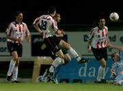 30 September 2005; Mark Farren,18, Derry City, shoots to score his sides first goal despite the challange from Dave Rogers and Jim Crawford, Shelbourne. eircom league, Premier Division, Derry City v Shelbourne, Brandywell, Derry. Picture credit: David Maher / SPORTSFILE