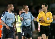 30 September 2005; Shelbourne players Jim Crawford, centre, and Dave Rogers, remonstrate with referee Ian Stokes, at half time. eircom league, Premier Division, Derry City v Shelbourne, Brandywell, Derry. Picture credit: David Maher / SPORTSFILE
