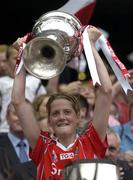 2 October 2005; Juliette Murphy, Cork, lifts the Brendan Martin Cup after victory over Galway. TG4 Ladies All-Ireland Senior Football Championship Final, Galway v Cork, Croke Park, Dublin. Picture credit: Pat Murphy / SPORTSFILE