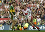 25 September 2005; Philip Jordan, Tyrone, celebrates a late point as Kerry's Eamon Fitzmaurice looks on. Bank of Ireland All-Ireland Senior Football Championship Final, Kerry v Tyrone, Croke Park, Dublin. Picture credit; Damien Eagers/ SPORTSFILE *** Local Caption *** Any photograph taken by SPORTSFILE during, or in connection with, the 2005 Bank of Ireland All-Ireland Senior Football Final which displays GAA logos or contains an image or part of an image of any GAA intellectual property, or, which contains images of a GAA player/players in their playing uniforms, may only be used for editorial and non-advertising purposes.  Use of photographs for advertising, as posters or for purchase separately is strictly prohibited unless prior written approval has been obtained from the Gaelic Athletic Association.