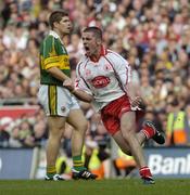 25 September 2005; Philip Jordan, Tyrone, celebrates a late pointas Kerry's Eamon Fitzmaurice looks on. Bank of Ireland All-Ireland Senior Football Championship Final, Kerry v Tyrone, Croke Park, Dublin. Picture credit; Damien Eagers/ SPORTSFILE *** Local Caption *** Any photograph taken by SPORTSFILE during, or in connection with, the 2005 Bank of Ireland All-Ireland Senior Football Final which displays GAA logos or contains an image or part of an image of any GAA intellectual property, or, which contains images of a GAA player/players in their playing uniforms, may only be used for editorial and non-advertising purposes.  Use of photographs for advertising, as posters or for purchase separately is strictly prohibited unless prior written approval has been obtained from the Gaelic Athletic Association.