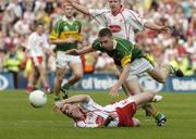 25 September 2005; Ryan McMenamin, Tyrone, in action against Kerry's Marc O'Se. Bank of Ireland All-Ireland Senior Football Championship Final, Kerry v Tyrone, Croke Park, Dublin. Picture credit; Damien Eagers/ SPORTSFILE *** Local Caption *** Any photograph taken by SPORTSFILE during, or in connection with, the 2005 Bank of Ireland All-Ireland Senior Football Final which displays GAA logos or contains an image or part of an image of any GAA intellectual property, or, which contains images of a GAA player/players in their playing uniforms, may only be used for editorial and non-advertising purposes.  Use of photographs for advertising, as posters or for purchase separately is strictly prohibited unless prior written approval has been obtained from the Gaelic Athletic Association.