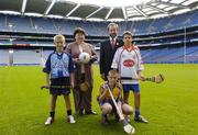 5 October 2005; Tanaiste and Minister for Health and Children, Mary Harney, T.D. with Sean Kelly, President of the GAA, and Na Fianna players, from left, Neil Flannery, Stephen Murray and Sean Gray at the launch of a new joint initiative by the GAA and the Department of Health and Children aimed at reducing alcohol-related harm and changing attitudes towards alcohol consumption in Ireland. Croke Park, Dublin. Picture credit: Damien Eagers / SPORTSFILE