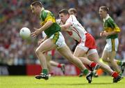 25 September 2005; Darragh O Se, Kerry, in action against Sean Cavanagh, Tyrone. Bank of Ireland All-Ireland Senior Football Championship Final, Kerry v Tyrone, Croke Park, Dublin. Picture credit; Ray McManus / SPORTSFILE *** Local Caption *** Any photograph taken by SPORTSFILE during, or in connection with, the 2005 Bank of Ireland All-Ireland Senior Football Final which displays GAA logos or contains an image or part of an image of any GAA intellectual property, or, which contains images of a GAA player/players in their playing uniforms, may only be used for editorial and non-advertising purposes.  Use of photographs for advertising, as posters or for purchase separately is strictly prohibited unless prior written approval has been obtained from the Gaelic Athletic Association.