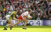 25 September 2005; Brian Dooher, Tyrone, in action against Darragh O Se, Kerry. Bank of Ireland All-Ireland Senior Football Championship Final, Kerry v Tyrone, Croke Park, Dublin. Picture credit; Ray McManus / SPORTSFILE *** Local Caption *** Any photograph taken by SPORTSFILE during, or in connection with, the 2005 Bank of Ireland All-Ireland Senior Football Final which displays GAA logos or contains an image or part of an image of any GAA intellectual property, or, which contains images of a GAA player/players in their playing uniforms, may only be used for editorial and non-advertising purposes.  Use of photographs for advertising, as posters or for purchase separately is strictly prohibited unless prior written approval has been obtained from the Gaelic Athletic Association.