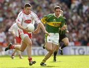 25 September 2005; Sean Cavanagh, Tyrone, in action against Declan O'Sullivan, Kerry. Bank of Ireland All-Ireland Senior Football Championship Final, Kerry v Tyrone, Croke Park, Dublin. Picture credit; Ray McManus / SPORTSFILE *** Local Caption *** Any photograph taken by SPORTSFILE during, or in connection with, the 2005 Bank of Ireland All-Ireland Senior Football Final which displays GAA logos or contains an image or part of an image of any GAA intellectual property, or, which contains images of a GAA player/players in their playing uniforms, may only be used for editorial and non-advertising purposes.  Use of photographs for advertising, as posters or for purchase separately is strictly prohibited unless prior written approval has been obtained from the Gaelic Athletic Association.