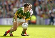 25 September 2005; Paul Galvin, Kerry, in action against Brian McGuigan, Tyrone. Bank of Ireland All-Ireland Senior Football Championship Final, Kerry v Tyrone, Croke Park, Dublin. Picture credit; Ray McManus / SPORTSFILE *** Local Caption *** Any photograph taken by SPORTSFILE during, or in connection with, the 2005 Bank of Ireland All-Ireland Senior Football Final which displays GAA logos or contains an image or part of an image of any GAA intellectual property, or, which contains images of a GAA player/players in their playing uniforms, may only be used for editorial and non-advertising purposes.  Use of photographs for advertising, as posters or for purchase separately is strictly prohibited unless prior written approval has been obtained from the Gaelic Athletic Association.