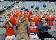 7 October 2005; World Handball Champions Kilkenny's DJ Carey and Cavan's Paul Brady with St Brigid’s players, back row from left, Ciaran Galvin, Ciaran Cahill, Conor Timoney, Donal Timoney, Brian O'Malley and Oisin Galvin, front row, Siobhan Cahill, left, and Sean O'Malley at the announcement of a new Mini-Handball promotion which will see a pack of free handball equipment, games ideas and in-school coaching available for primary schools and juvenile sections in GAA Clubs throughout the country. Croke Park, Dublin. Picture credit: Damien Eagers / SPORTSFILE