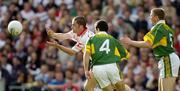 25 September 2005; Stephen O'Neill, Tyrone, in action against Tom O'Sullivan, 4, and Tomas O Se, Kerry, Kerry v Tyrone. Bank of Ireland All-Ireland Senior Football Championship Final, Kerry v Tyrone, Croke Park, Dublin. Picture credit; Ray McManus / SPORTSFILE *** Local Caption *** Any photograph taken by SPORTSFILE during, or in connection with, the 2005 Bank of Ireland All-Ireland Senior Football Final which displays GAA logos or contains an image or part of an image of any GAA intellectual property, or, which contains images of a GAA player/players in their playing uniforms, may only be used for editorial and non-advertising purposes.  Use of photographs for advertising, as posters or for purchase separately is strictly prohibited unless prior written approval has been obtained from the Gaelic Athletic Association.