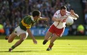 25 September 2005; Davy Harte, Tyrone, in action against Paul Galvin, Kerry. Bank of Ireland All-Ireland Senior Football Championship Final, Kerry v Tyrone, Croke Park, Dublin. Picture credit; Ray McManus / SPORTSFILE *** Local Caption *** Any photograph taken by SPORTSFILE during, or in connection with, the 2005 Bank of Ireland All-Ireland Senior Football Final which displays GAA logos or contains an image or part of an image of any GAA intellectual property, or, which contains images of a GAA player/players in their playing uniforms, may only be used for editorial and non-advertising purposes.  Use of photographs for advertising, as posters or for purchase separately is strictly prohibited unless prior written approval has been obtained from the Gaelic Athletic Association.