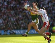25 September 2005; Davy Harte, Tyrone, in action against Paul Galvin, Kerry. Bank of Ireland All-Ireland Senior Football Championship Final, Kerry v Tyrone, Croke Park, Dublin. Picture credit; Ray McManus / SPORTSFILE *** Local Caption *** Any photograph taken by SPORTSFILE during, or in connection with, the 2005 Bank of Ireland All-Ireland Senior Football Final which displays GAA logos or contains an image or part of an image of any GAA intellectual property, or, which contains images of a GAA player/players in their playing uniforms, may only be used for editorial and non-advertising purposes.  Use of photographs for advertising, as posters or for purchase separately is strictly prohibited unless prior written approval has been obtained from the Gaelic Athletic Association.
