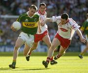 25 September 2005; Marc O Se, Kerry, in action against Conor Gormley, Tyrone. Bank of Ireland All-Ireland Senior Football Championship Final, Kerry v Tyrone, Croke Park, Dublin. Picture credit; Ray McManus / SPORTSFILE *** Local Caption *** Any photograph taken by SPORTSFILE during, or in connection with, the 2005 Bank of Ireland All-Ireland Senior Football Final which displays GAA logos or contains an image or part of an image of any GAA intellectual property, or, which contains images of a GAA player/players in their playing uniforms, may only be used for editorial and non-advertising purposes.  Use of photographs for advertising, as posters or for purchase separately is strictly prohibited unless prior written approval has been obtained from the Gaelic Athletic Association.