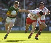 25 September 2005; Marc O Se, Kerry, in action against Conor Gormley, Tyrone. Bank of Ireland All-Ireland Senior Football Championship Final, Kerry v Tyrone, Croke Park, Dublin. Picture credit; Ray McManus / SPORTSFILE *** Local Caption *** Any photograph taken by SPORTSFILE during, or in connection with, the 2005 Bank of Ireland All-Ireland Senior Football Final which displays GAA logos or contains an image or part of an image of any GAA intellectual property, or, which contains images of a GAA player/players in their playing uniforms, may only be used for editorial and non-advertising purposes.  Use of photographs for advertising, as posters or for purchase separately is strictly prohibited unless prior written approval has been obtained from the Gaelic Athletic Association.