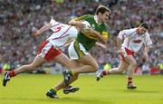 25 September 2005; Eoin Brosnan, Kerry, in action against Davy Harte, Tyrone. Bank of Ireland All-Ireland Senior Football Championship Final, Kerry v Tyrone, Croke Park, Dublin. Picture credit; Ray McManus / SPORTSFILE *** Local Caption *** Any photograph taken by SPORTSFILE during, or in connection with, the 2005 Bank of Ireland All-Ireland Senior Football Final which displays GAA logos or contains an image or part of an image of any GAA intellectual property, or, which contains images of a GAA player/players in their playing uniforms, may only be used for editorial and non-advertising purposes.  Use of photographs for advertising, as posters or for purchase separately is strictly prohibited unless prior written approval has been obtained from the Gaelic Athletic Association.