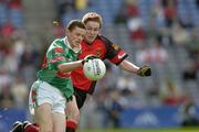 25 September 2005; Pierce Hanley, Mayo, in action against Kevin Duffin, Down. ESB All-Ireland Minor Football Championship Final, Mayo v Down, Croke Park, Dublin. Picture credit; Ray McManus / SPORTSFILE *** Local Caption *** Any photograph taken by SPORTSFILE during, or in connection with, the 2005 ESB All-Ireland Minor Football Final which displays GAA logos or contains an image or part of an image of any GAA intellectual property, or, which contains images of a GAA player/players in their playing uniforms, may only be used for editorial and non-advertising purposes.  Use of photographs for advertising, as posters or for purchase separately is strictly prohibited unless prior written approval has been obtained from the Gaelic Athletic Association.