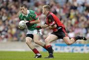 25 September 2005; Paraic O'Connor, Mayo, in action against Peter Fitzpatrick, Down. ESB All-Ireland Minor Football Championship Final, Mayo v Down, Croke Park, Dublin. Picture credit; Ray McManus / SPORTSFILE *** Local Caption *** Any photograph taken by SPORTSFILE during, or in connection with, the 2005 ESB All-Ireland Minor Football Final which displays GAA logos or contains an image or part of an image of any GAA intellectual property, or, which contains images of a GAA player/players in their playing uniforms, may only be used for editorial and non-advertising purposes.  Use of photographs for advertising, as posters or for purchase separately is strictly prohibited unless prior written approval has been obtained from the Gaelic Athletic Association.