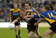 9 October 2005; Barry Watters, Dunboyne, is tackled by Tadhg Brosnan, 14, Mark Crampton and Anthony Moyles, Blackhall Gaels. Meath County Senior Football Final, Dunboyne v Blackhall Gaels, Pairc Tailteann, Navan, Co. Meath. Picture credit: Matt Browne / SPORTSFILE