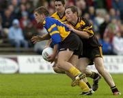 9 October 2005; Tadgh Brosnan, Blackhall Gaels, is tackled by Colin Clarke, Dunboyne. Meath County Senior Football Final, Dunboyne v Blackhall Gaels, Pairc Tailteann, Navan, Co. Meath. Picture credit: Matt Browne / SPORTSFILE
