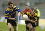 9 October 2005; Ger Robinson, Dunboyne, is tackled by Noel O'Hora, Blackhall Gaels. Meath County Senior Football Final, Dunboyne v Blackhall Gaels, Pairc Tailteann, Navan, Co. Meath. Picture credit: Matt Browne / SPORTSFILE