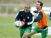 10 October 2005; Stephen Carr, Republic of Ireland, in action against team-mate Gary Breen during squad training. Malahide FC, Malahide, Dublin. Picture credit: David Maher / SPORTSFILE