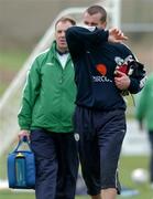 10 October 2005; Shay Given, Republic of Ireland goalkeeper, leaves the pitch with team physio Ciaran Murray after falling over on his left foot during squad training. Malahide FC, Malahide, Dublin. Picture credit: David Maher / SPORTSFILE