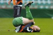 11 October 2005; Richard Dunne, Republic of Ireland, lies injured after a challange with team-mate Kevin Doyle, which resulted in him leaving the pitch and receiving treatment. Lansdowne Road, Dublin. Picture credit: David Maher / SPORTSFILE