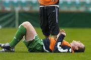 11 October 2005; Richard Dunne, Republic of Ireland, lies injured after a challange with team-mate Kevin Doyle, which resulted in him leaving the pitch for treatment. Lansdowne Road, Dublin. Picture credit: David Maher / SPORTSFILE