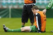 11 October 2005; Richard Dunne, Republic of Ireland, lies injured after a challange with team-mate Kevin Doyle, which resulted in him leaving the pitch for treatment. Lansdowne Road, Dublin. Picture credit: David Maher / SPORTSFILE