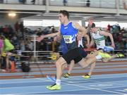 22 March 2014; Ryan Murray, Bree A.C., Wexford, crosses the line to win the U17 Boy's 60m Final. Woodie’s DIY Juvenile Indoor Track and Field Championships, Athlone Institute of Technology Arena, Athlone, Co. Westmeath. Picture credit: Pat Murphy / SPORTSFILE