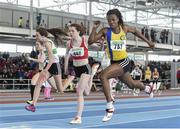 22 March 2014; Gina Akpe-Moses, Blackrock A.C., Co. Louth, right, crosses the finish line ahead of Lauren Ryan, Dooneen A.C., Limerick, centre, and Ciara Neville, Emerald A.C., Limerick, left, to win the U16 Girl's 60m Final. Woodie’s DIY Juvenile Indoor Track and Field Championships, Athlone Institute of Technology Arena, Athlone, Co. Westmeath. Picture credit: Pat Murphy / SPORTSFILE