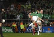12 October 2005; Ian Harte, (3), Republic of Ireland, heads goalwards watched by team-mate Richard Dunne. FIFA 2006 World Cup Qualifier, Group 4, Republic of Ireland v Switzerland, Lansdowne Road, Dublin. Picture credit: Brendan Moran / SPORTSFILE