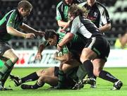 14 October 2005; Conor McPhilips, Connacht, is tackled by Adam Jones, Neath Swansea Ospreys. Celtic League 2005-2006, Group A, Neath Swansea Ospreys v Connacht, Regional Rugby Stadium, Swansea, Wales. Picture credit: Tim Parfitt / SPORTSFILE