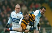 16 October 2005; Tony McEntee, Crossmaglen Rangers, in action against Michael O'Rourke, right, and Damian Kilgallon, Dromintee. Armagh County Senior Football Final, Crossmaglen Rangers v Dromintee, Crossmaglen, Armagh. Picture credit: David Maher / SPORTSFILE