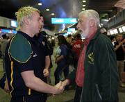 16 October 2005; Owen Mulligan and Sean Cavanagh are greeted by Sean O'Casey, President of the GAA of Western Australia, formerly of Dungannon Co. Tyrone, at Perth International Airport in advance of the Fosters International Rules game between Australia and Ireland. Perth, Western Australia. Picture credit; Ray McManus / SPORTSFILE
