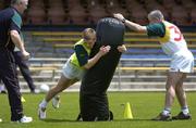 17 October 2005; Selector Larry Tompkins and Manager Pete McGrath stand clear as Ross Munnelll 'tackles' a tackle bag during a training session in advance of the Fosters International Rules game between Australia and Ireland. Claremont, Perth, Western Australia. Picture credit; Ray McManus / SPORTSFILE
