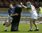 17 October 2005; Manager Pete McGrath stands clear as Michael McVeigh 'tackles' a tackle bag during a training session in advance of the Fosters International Rules game between Australia and Ireland. Claremont, Perth, Western Australia. Picture credit; Ray McManus / SPORTSFILE