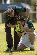 18 October 2005; Dr. Con Murphy attends to team captain Padraic Joyce, who suffered from a nose bleed, during a training session, at the Mandurah Football and Sports Club, in advance of the Fosters International Rules game between Australia and Ireland. Mandurah Football and Sports Club, Rushton Park, Mandurah, Perth, Western Australia. Picture credit; Ray McManus / SPORTSFILE