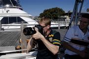 18 October 2005; Anthony Lynch, under the watchful eye of his colleague Graham Canty, uses a camera to zoom in on some of the boats during a cruise around the Mandurah area. Mandurah, Perth, Western Australia. Picture credit; Ray McManus / SPORTSFILE