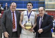 23 March 2014; Christan Anon, C&S UCC Demons, is presented with the MVP by Bernard O'Byrne, left, Chief Executive, Basketball Ireland and Gerry Kelly, President, Basketball Ireland. Basketball Ireland Champions Trophy Final, C&S UCC Demons, Cork v Killester, Dublin. Neptune Stadium, Cork. Picture credit: Brendan Moran / SPORTSFILE
