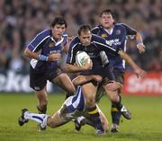 22 October 2005; Felipe Contepomi, Leinster, supported by team-mates Shane Horgan, left, and Reggie Corrigan, right, is tackled by Chris Malone, Bath. Heineken Cup 2005-2006, Pool 5, Round 1, Leinster v Bath. RDS, Ballsbridge, Dublin. Picture credit: Brendan Moran / SPORTSFILE