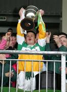 23 October 2005; Carrickmore captain Brian Gormley lifts the O'Neill Cup after victory over Omagh. Tyrone Senior Football Championship Final, Omagh v Carrickmore, Healy Park Omagh, Co. Tyrone. Picture credit: Oliver McVeigh / SPORTSFILE