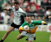 23 October 2005; Gabriel Callan, Carrickmore, in action against Dean O'Neill, Omagh. Tyrone Senior Football Championship Final, Omagh v Carrickmore. Omagh, Co. Tyrone. Picture credit: Oliver McVeigh / SPORTSFILE