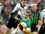 23 October 2005; Finbar Magill, Carrickmore, in action against David McKenna, Omagh. Tyrone Senior Football Championship Final, Omagh v Carrickmore. Omagh, Co. Tyrone. Picture credit: Oliver McVeigh / SPORTSFILE